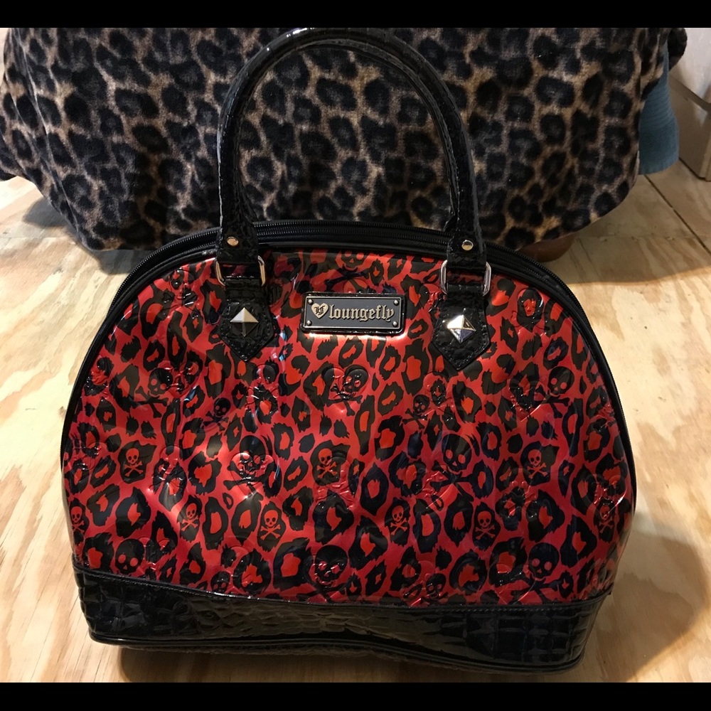 Loungefly 14”x11“ Red and black patent leather purse with wallet.